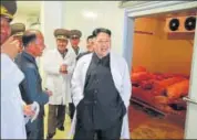  ?? AFP ?? North Korean leader Kim JongUn (right) visits a pig farm at Taechon Air Base of the Korean People's Army.