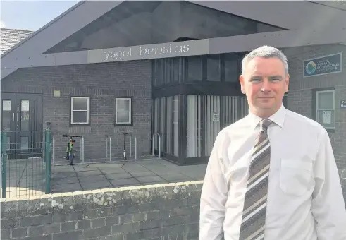  ??  ?? Rhys Parry, Chair of Governors at Ysgol Henblas, says the closure threat is ‘a shock – feelings are very strong locally’