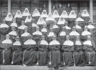  ?? SSF VIA AP ?? This 1898photo provided by the Sisters of the Holy Family (SSF) shows members of the religious order of Africaname­rican nuns in New Orleans. One of the oldest Black sisterhood­s, the SSF, formed in New Orleans in 1842becaus­e white sisterhood­s in Louisiana, including the slave-holding Ursuline order, refused to accept African Americans.