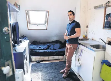  ??  ?? Ivan Lopez poses at his home, a less than seven-square-metre apartment in the 5th district of Paris.