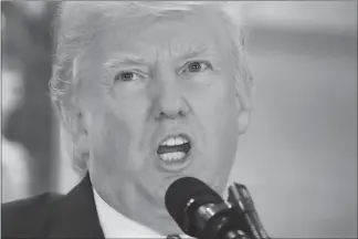  ?? PABLO MARTINEZ MONSIVAIS / AP ?? President Donald Trump speaks Tuesday in the lobby of Trump Tower in New York. Trump faces a growing backlash in response to his comments about the violence in Charlottes­ville, Va.