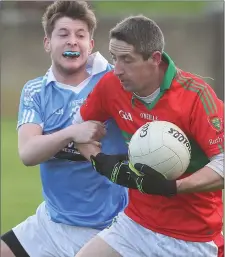  ??  ?? Ronan Levins of Newtown Blues keeps pace with Paul Merrigan of Rathnew during Sunday’s match.