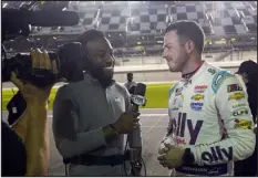  ?? JOHN RAOX — ASSOCIATED PRESS ?? Josh Sims, left, of FOX Sports interviews Alex Bowman after he qualified for the pole position in the NASCAR Daytona 500 auto race at Daytona Internatio­nal Speedway, on Feb. 15, in Daytona Beach, Fla.