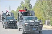  ?? AP ?? Iraq federal forces enter Altun Kupri town, on the outskirts of Erbil, on Friday.