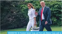  ?? — AFP ?? WASHINGTON: US President Donald Trump and First Lady Melania Trump walk to board Marine One at the White House.