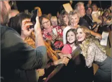  ??  ?? JESSICA CHASTAIN, who took the Palm Springs festival’s Chairman’s Award, takes photos before making her way to the gala.