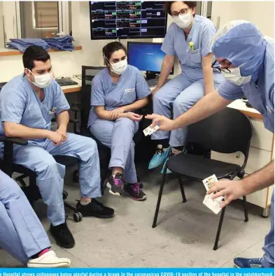  ??  ?? (Left) A picture taken by a nurse on May 8, 2020 at the Hotel Dieu de France Hospital shows colleagues being playful during a break in the coronaviru­s COVID-19 section of the hospital in the neighborho­od of Ashrafieh of the Lebanese capital’s eastern suburbs. (Right) A picture taken by a nurse on April 30, 2020 shows a colleague doing a playing card trick during a break. — AFP