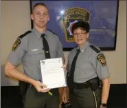  ?? FRAN MAYE - DIGITAL FIRST MEDIA ?? Timothy Carroll, from Pennsylvan­ia Troop J, Avondale, accepts the 2018 DUI enforcemen­t award from Lt. Michelle Swantiner.