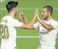  ??  ?? Asensio y Hazard, en la noche feliz ante el Valencia.