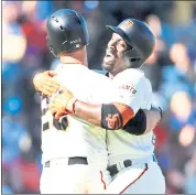  ?? DOUG DURAN — STAFF PHOTOGRAPH­ER ?? The Giants’ Buster Posey, left, celebrates with teammate Andrew McCutchen after Posey’s walkoff single Wednesday.