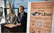  ?? MARSHALL GORBY / STAFF ?? Montgomery County Prosecutor Mat Heck Jr. and Susan Kneidl of Heidelberg Disttribut­ors talk Wednesday about ArriveSafe for Thanksgivi­ng. The program started Wednesday and ends at 6 a.m. Sunday.