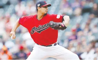  ?? JOE ROBBINS/GETTY IMAGES ?? Carlos Carrasco, who returned to pitch for the Indians this season after undergoing chemothera­py treatments in his battle with leukemia, says he hopes to continue giving back to others.