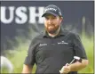  ?? Peter Morrison / Associated Press ?? Shane Lowry reacts after putting on the 18th green on Saturday.