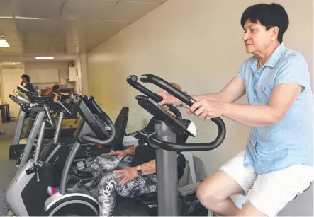  ?? Picture: Bev Lacey ?? HEART HEALTH: Kate Powell uses one of the new exercise bikes at St Andrew's Hospital cardiac rehab unit which was bought using money she raised from the performanc­e of her play.