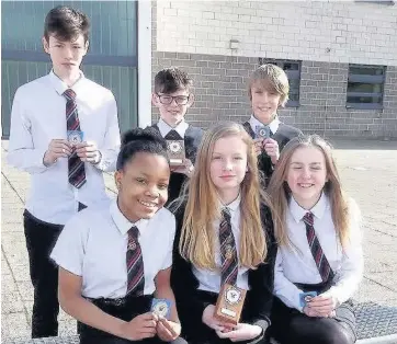  ??  ?? S2 cross-country medallists Back row — Lewis Barclay, Lewis Hannigan and Ethan Furze, and, front, Ebo Anyebe, Ola ZuraKowska and Eve Braes