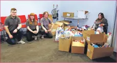  ??  ?? Campbeltow­n Picture House staff, from left, Jamie Field, Gemma Downie, Ellen Mainwood and Mhairi Hendrie with the donated food items. KC_c09cansfes­t01