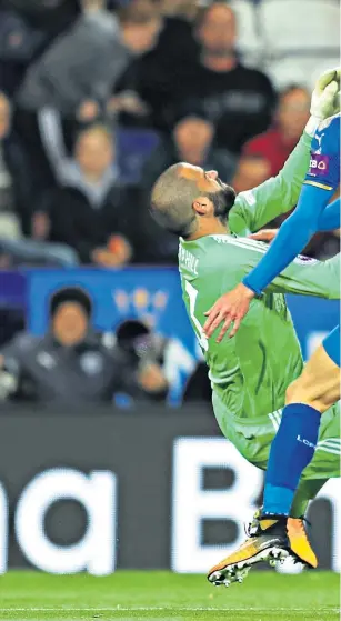  ??  ?? Keeper pain 1: Leicester striker Jamie Vardy feels the force of a challenge from West Bromwich goalkeeper Boaz Myhill. Both players were able to continue although Myhill received a yellow card.