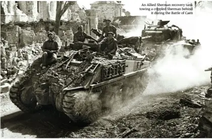  ??  ?? An Allied Sherman recovery tank towing a crippled Sherman behind it during the Battle of Caen