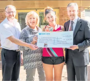  ??  ?? Alana Harries (third from left) with three members of the fundraisin­g committee: vice-chairman Andrew Stephens, secretary Susan Thomas, and chairman David Craddock.