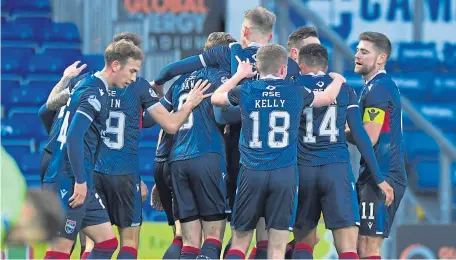  ??  ?? County players celebrate their goal