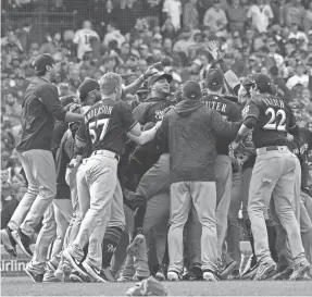  ?? PATRICK GORSKI/USA TODAY SPORTS ?? The Brewers celebrate at Wrigley Field after knocking off the Cubs to win the NL Central Division title Monday.