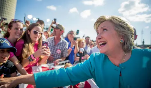  ?? — AP ?? Hillary Clinton greets supporters following a ‘Get out the vote’ rally at Curtis Hixon Waterfront Park in downtown Tampa, Florida, on Wednesday.