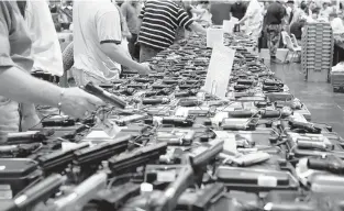  ?? FILE PHOTO ?? A new law makes it illegal for Virginians to sell their personally owned firearms without buyers clearing background checks that can only be handled by federally licensed dealers.