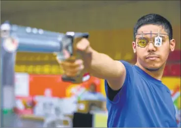  ??  ?? ▪ (Top) Udhayveer Sidhu won gold in U-17 air pistol, while twin brother Vijayveer (below) bagged silver in U-21 category.