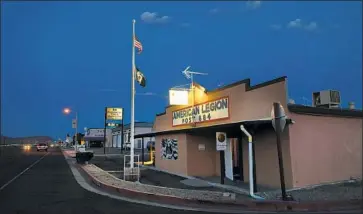  ??  ?? THE AMERICAN LEGION post in Ridgecrest, one of the communitie­s that grew up around the Naval Air Weapons Station. “We’re a long way away from things, so we rely on each other,” says one 90-year-old resident.