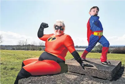  ?? ?? Is it a bird, is it a plane? Julie Morrison and young son Leon promote this year’s superhero run