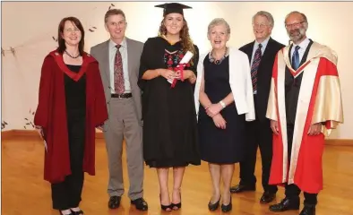  ??  ?? Pictured recently receiving the award with her parents John and Maura Earley is Prof. Kelly-Holmes, Prof. Emiratus Edward Maxon Browne and Dr Joachim Fischer, School of Modern Languages and Applied Linguistic­s and UL.