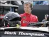  ?? TERRY RENNA — THE ASSOCIATED PRESS ?? Mark Thompson prepares to climb into his car before practice for the NASCAR Daytona 500 auto race at Daytona Internatio­nal Speedway in Daytona Beach, Fla., Friday. Thompson, 66, will start 40th in the race.