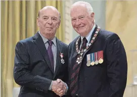  ?? CANADIAN PRESS FILE PHOTO ?? Hockey play-by-play great Bob Cole is set to return to the hockey broadcast booth for one last season. Governor General David Johnston is seen with Cole in 2016 as Cole was invested as a Member of the Order of Canada.