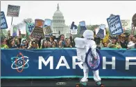  ?? YIN BOGU / XINHUA ?? Protesters take part in the March for Science in Washington, US, on Saturday. Similar events were held in other US cities and across the world.
