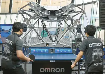  ?? KAZUHIRO NOGI /GETTY-AFP ?? Forpheus, a seventh-generation table tennis playing robot developed by Japanese electronic­s maker Omron, returns a shot during a press preview Friday at Tokyo’s National Museum of Emerging Science and Innovation.