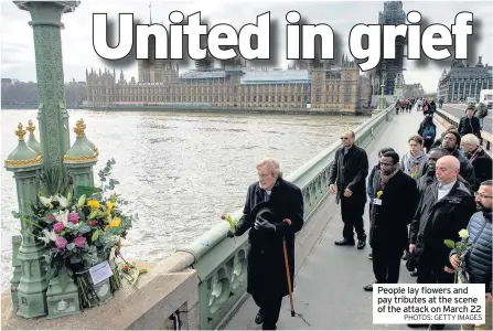  ?? PHOTOS: GETTY IMAGES ?? People lay flowers and pay tributes at the scene of the attack on March 22