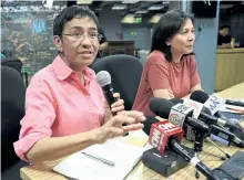  ?? TED ALJIBE/GETTY IMAGES ?? Maria Ressa, left, CEO and editor of online portal Rappler, speaks during a press conference in Manila on Monday. The Philippine government has revoked news outlet’s operating licence.