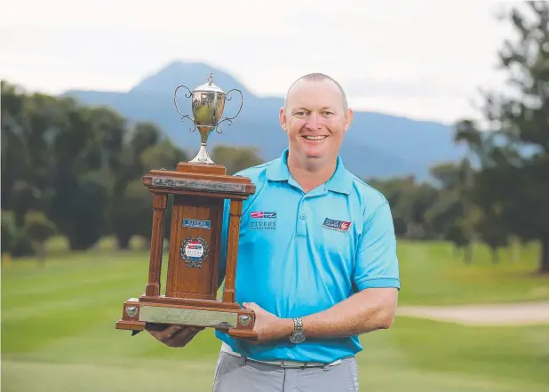 ?? Picture: BRENDAN RADKE ?? BIRTHDAY BONUS: Frank Power with the City of Cairns Open trophy he won as he celebrated his 44th birthday.