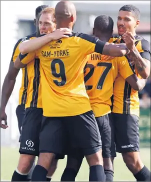  ?? FM4915258 Buy this picture from kentonline.co.uk ?? Zavon Hines is mobbed by his team-mates after scoring the opener on Saturday against Woking