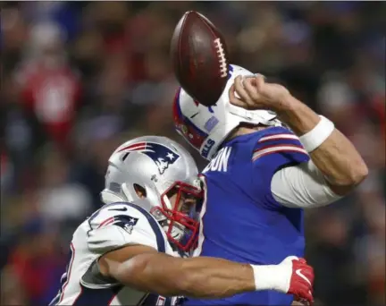  ?? JEFFREY T. BARNES - THE ASSOCIATED PRESS ?? Buffalo Bills quarterbac­k Derek Anderson, right, fumbles the ball on a hit by New England Patriots linebacker Kyle Van Noy during the second half of an NFL football game, Monday, Oct. 29, 2018, in Orchard Park, N.Y. The Patriots recovered the fumble on the play.