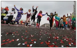  ?? (AP/Sergei Grits) ?? Women in Minsk, Belarus, take part in a Beauty Run on Sunday during celebratio­ns for Internatio­nal Women’s Day, an official holiday in the country. More photos at arkansason­line.com/39women/.
