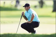  ?? Gregory Shamus / Getty Images ?? Patrick Reed lines up a putt during Friday’s second round of the U.S. Open in Mamaroneck, N.Y.