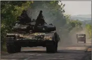  ?? (AP/Bernat Armangue) ?? A Ukraine army tank moves to a position in the Donetsk region of eastern Ukraine on Thursday.