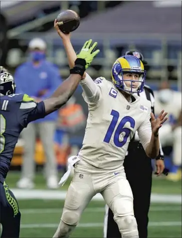  ?? Elaine Thompson Associated Press ?? AFTER JARED GOFF broke his thumb in the Rams’ loss at Seattle on Dec. 27, Sean McVay said he would be ready for the playoffs. The coach said Tuesday he hadn’t decided who would start against the Seahawks.