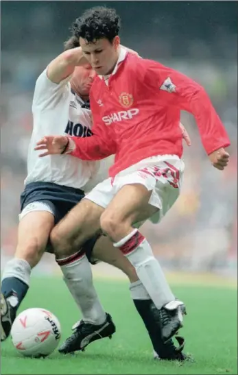  ?? GETTY IMAGES ?? ALWAYS SHARP: Spurs Gary Mabbutt, now long retired, tries to get the ball off a young Ryan Giggs in 1992.