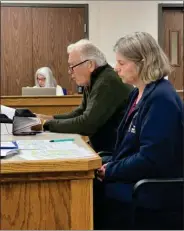  ?? PILOT NEWS GROUP PHOTO / JAMIE FLEURY ?? Deborah Vandemark and Paul Levett, both of Culver, approach Marshall County Commission­ers on Solar Projects during public input.