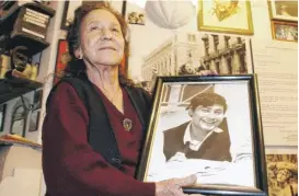  ?? JOSE LUIS MAGANA/AP ?? Human rights activist Rosario Ibarra de Piedra in 2003 with a photo of her son Jesus Piedra, who disappeare­d during Mexico’s “dirty war.” She ran for president of Mexico in 1982.
