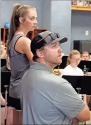  ?? Jeremy Stewart ?? New Rockmart High School band director Connor Teems (right) watches a recent practice with drum major Abby Grace Allred.
