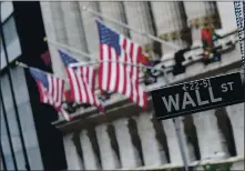  ?? MARY ALTAFFER — THE ASSOCIATED PRESS ?? The Federal Reserve said Monday that American households’ net worth jumped nearly 7% in the April-June quarter to $119 trillion as the stock market recovered from pandemic-induced plunge. That figure had sunk to $111.3 trillion in the first quarter.