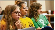  ?? LYNDA M. GONZÃLEZ / AMERICAN-STATESMAN ?? Austin public school students Olivia Hoffman, Gaelila McKaughan and Pearl Morosky listen to testimony at a state Senate hearing on school safety on Tuesday.